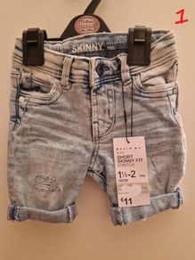 A selection of brand new baby clothes and items