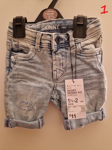 A selection of brand new baby clothes and items