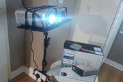 philips neopix ultra 2tv+ home projector and height adjustable stand, built in speakers and android TV with play store stand comes with power point bracket on it as seen in pictures also remote and phone holder