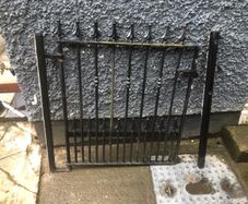 Set of wrought iron driveway gates and side gate