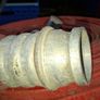 Coiled Red Canvas Fire Hydrant Hose with aluminium coupling and internal fitting visible at centre Image 3