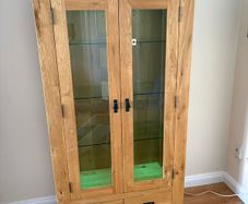 Living room Tall oak side board 2 glass doors and 2 drawers with lights,