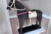 Vintage stuffed horse on plinth