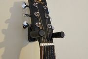 Wall-mounted guitar holder