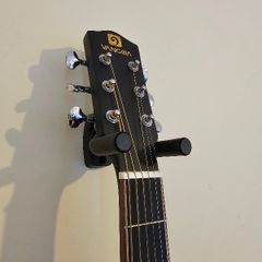 Wall-mounted guitar holder