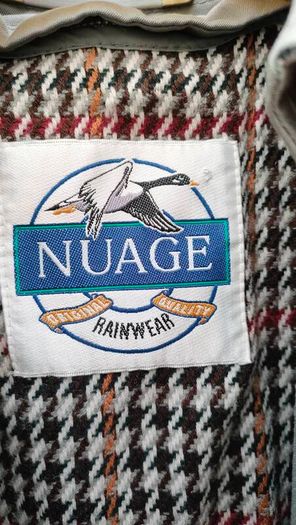 Vintage Nuage ladies trenchcoat Approximately late 90s early 00s Size 10 on label The colour is a pale bluey grey with brown buttons It's got an inner lining that can be removed