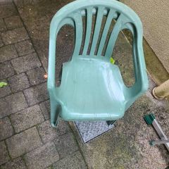Pair of green plastic garden chairs