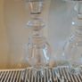 2 large glass candle sticks with candles Image 2