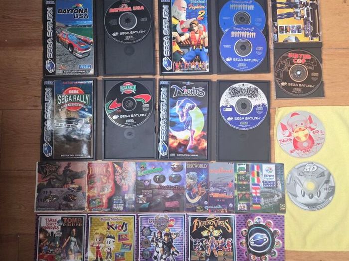 Sega Saturn w/ 3D Control Pad, Arcade Racer, Lightgun and Games