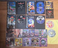 Sega Saturn w/ 3D Control Pad, Arcade Racer, Lightgun and Games