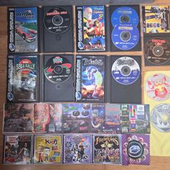Sega Saturn w/ 3D Control Pad, Arcade Racer, Lightgun and Games