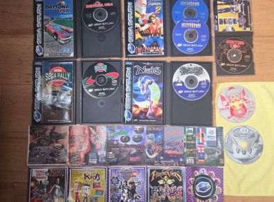 Sega Saturn w/ 3D Control Pad, Arcade Racer, Lightgun and Games