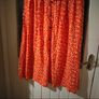 Asos Printed Crepe Midi Skirt features an orange ditsy floral print and a button down front. New with Tags Image 6