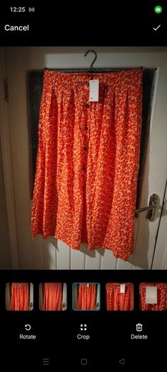 Asos Printed Crepe Midi Skirt features an orange ditsy floral print and a button down front. New with Tags