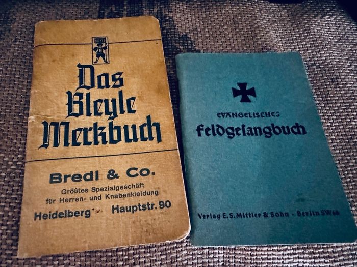 WW2 German documents with an eagle pin and an identification tag for one soldier