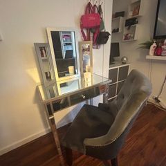 Mirrored vanity table with matching chair