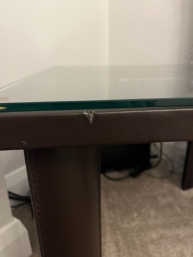 Square Glass coffe table with brown leather upholstery