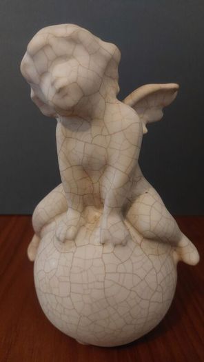 Lovely Vintage Pair of Ceramic Baby Winged Angels Sitting on Globes with a Very Tactile Cream Coloured Crackle Glaze
