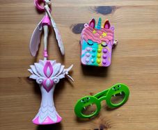 Assorted toys including Flying Fairy, Unicorn wallet, Frog Glasses