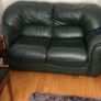 Green sofa with throw and cushions Image 2