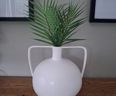 White Ceramic Vase with Green Decorative Grass