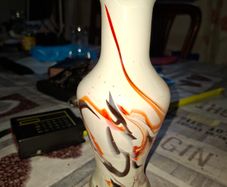 Beautiful Old white glass Dalian Snowflake Vase with a ruffled rim and orange and brown swirl design Postage Available