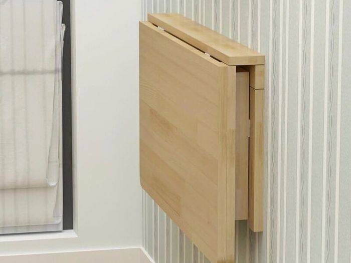 Wall mounted folding table