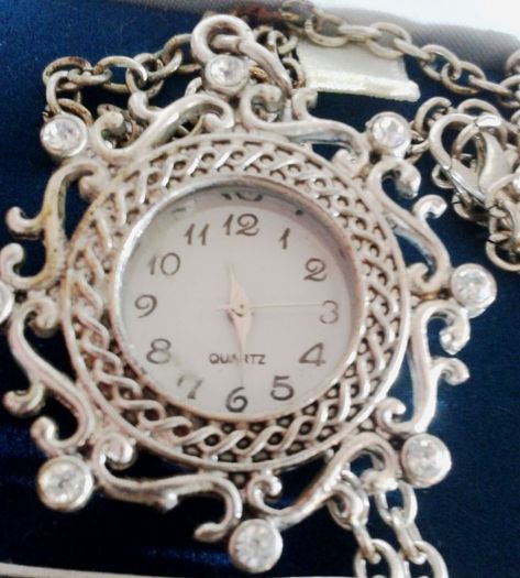 Ladies Quartz Necklace Watch with Filigree Design on Casing and Surrounded by 8 White-Silver Diamante Stones.