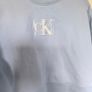 Calvin Klein Jeans cropped sweatshirt pale blue sequin logo size L EUR 40 42 UK 12 14 Image 2