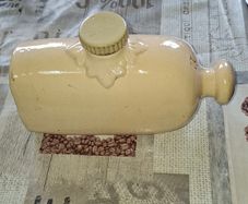 Vintage Cream-Glazed Stoneware Hot Water Bottle, commonly used as a bed or foot warmer during the 19th. Postage Available or Collection