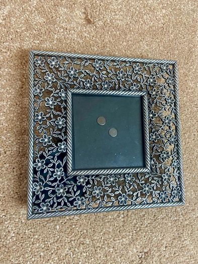 Small metal picture frame with flower detail