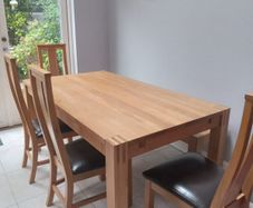 solid oak dining table and 4 chairs
