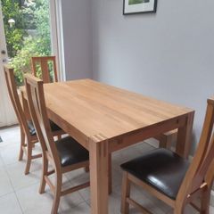 solid oak dining table and 4 chairs