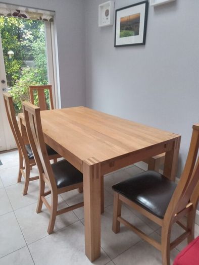 solid oak dining table and 4 chairs