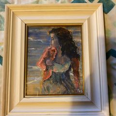 painting This is an atmospheric portrait depicting a woman standing on a coastal shore at dusk or twilight, clutching a reddish-pink wrap or cardigan around her shoulders.