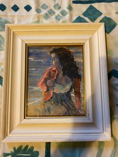 painting This is an atmospheric portrait depicting a woman standing on a coastal shore at dusk or twilight, clutching a reddish-pink wrap or cardigan around her shoulders.