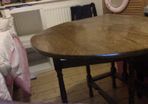 Oval gateleg dark oak dining table