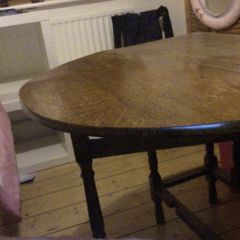 Oval gateleg dark oak dining table