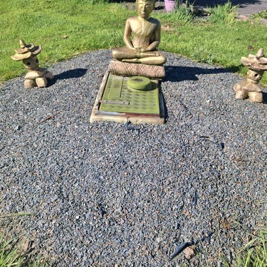 3 stone garden ornaments as seen