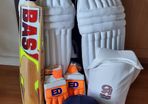 Adult cricket bat and pads