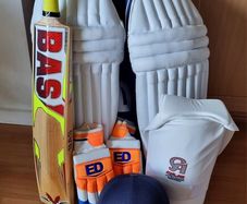 Adult cricket bat and pads