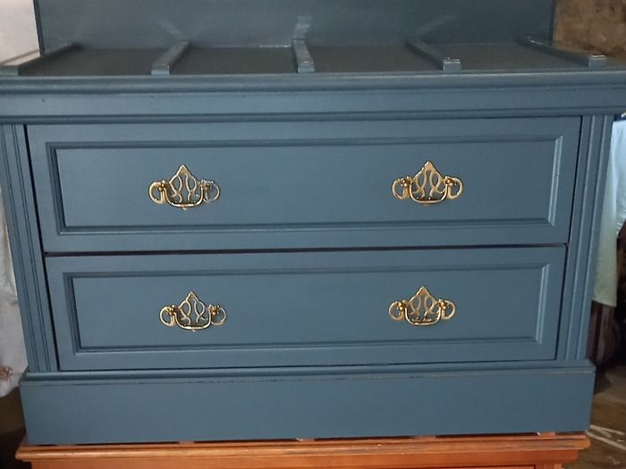 Chest drawers with brass strip suitcase set down