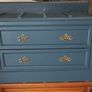 Chest drawers with brass strip suitcase set down Image 2