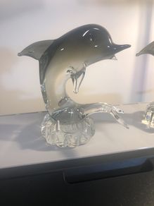 2 glass Dolphins
