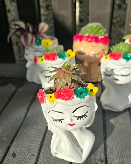 small handmade flower pots with real plants