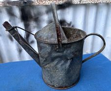 Vintage galvanised watering can