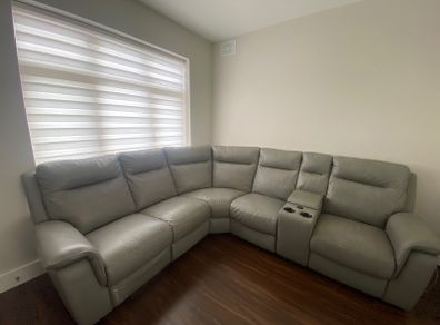Brand new leather recliner sofa for sale with usb charge ports, wireless charger and cup holders