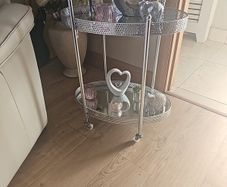 drinks trolly and large flower arrangement with vase