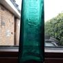 Vintage Coloured Glass Embossed Bottle Image 3