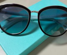 Tiffany & Co. TF4146 sunglasses featuring black frames and soft gradient lenses